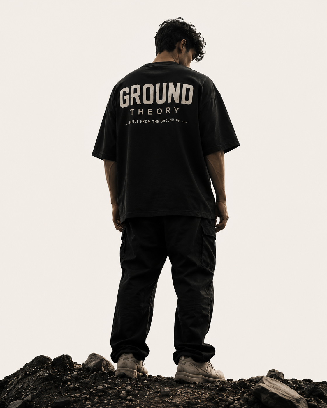 Model in dark streetwear editorial look