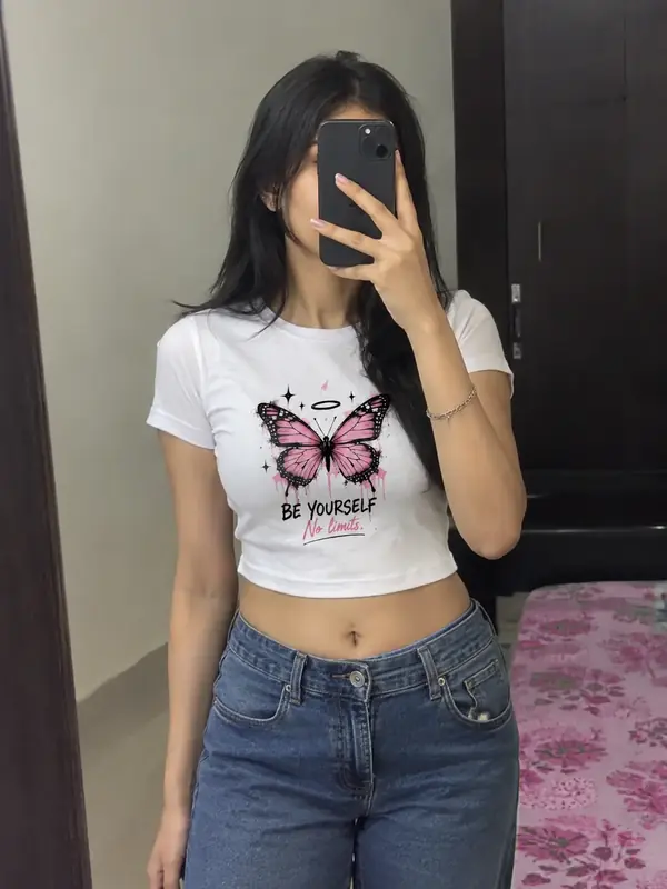 Customer taking a selfie in the baby tee